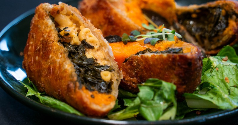 Egg rolls stuffed with collard greens, mac and cheese and carrot souffle