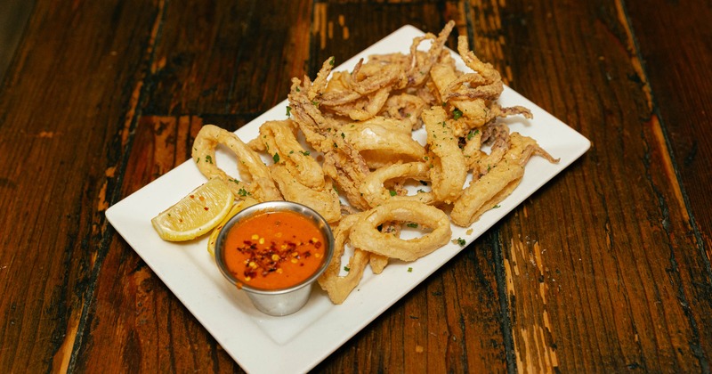 Fried calamari served with a dipping sauce