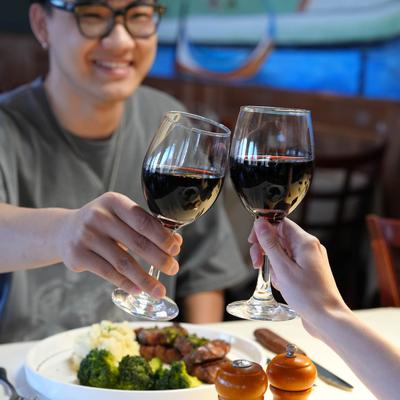 People toasting with their drinks.