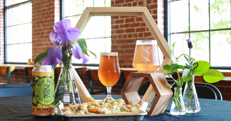 Served drinks and food with a flower arrangement