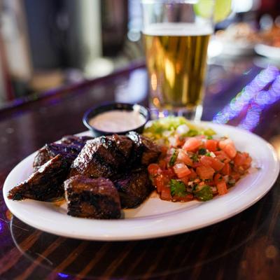 Steak with pico de gallo, dressing and beer