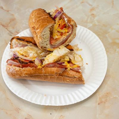 Italian sub sandwich with deli meats and veggies.