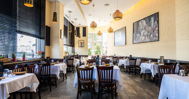 Restaurant interior, dining area with set tables