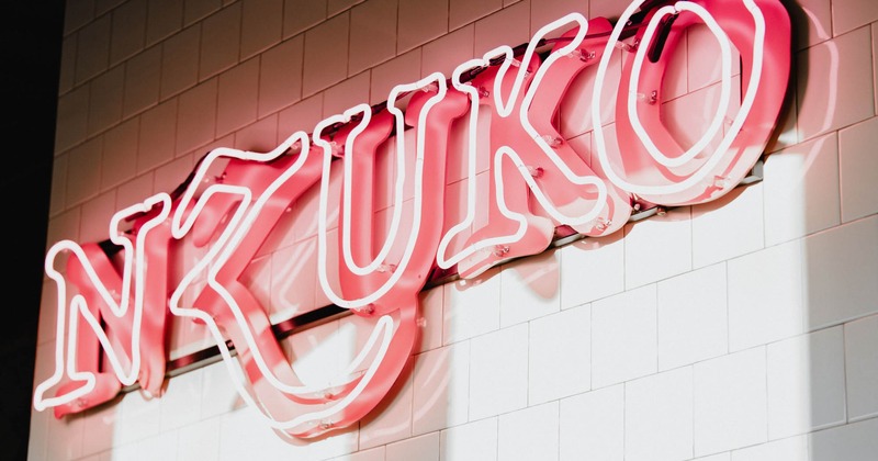 The restaurant's name in neon lights