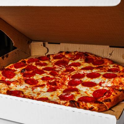 Pepperoni pizza in a box.