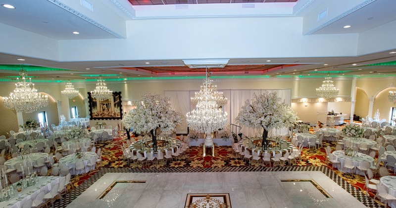 Elegant banquet hall - chandeliers, marble floor and decorated tables