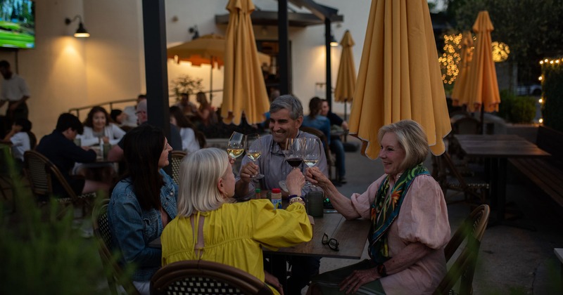 Customers toasting with wine