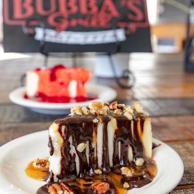 Turtle Cheesecake served on the table with Strawberry Cheesecake.