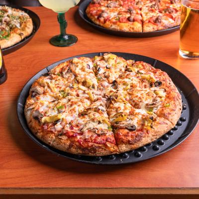 Classic Vegetarian Pizza alongside other pizzas and drinks.