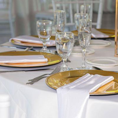 Utensils, glasses, plates, and napkins.