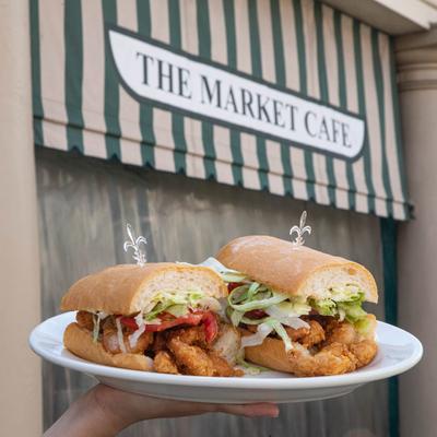 Shrimp Po Boy plate, hand held outside of the Market Cafe