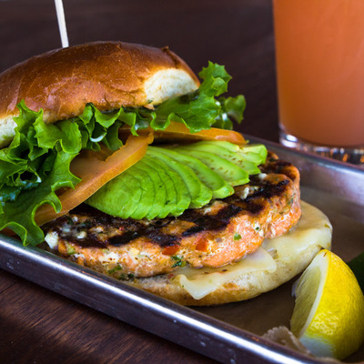 Fishburger with avocado and tomato