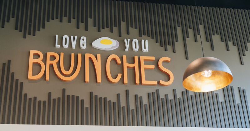 Interior, big 3d sign on the wall above the diner area