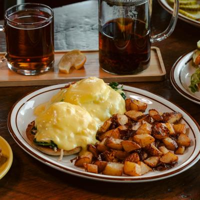 Our Lobster Benedict topped with poached eggs and hollandaise sauce served with roasted potatoes..