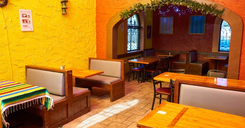 Interior, tables, benches with leather cushion and back and chairs