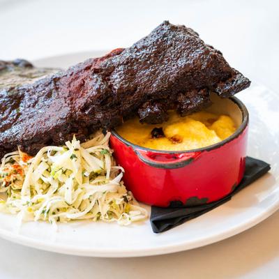 Blackberry BBQ Pork Ribs, with jicama apple slaw, and cheddar grits