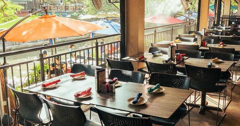 Cozy patio dining area with dining tables set for guests