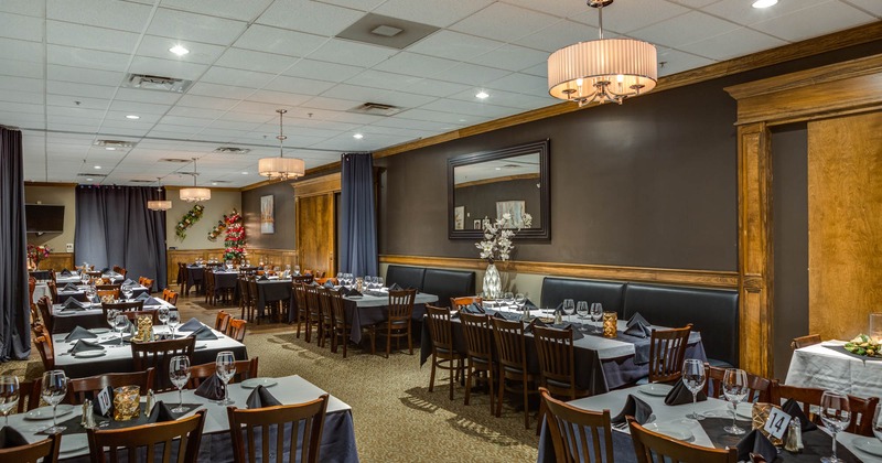 Spacious Dining room with place settings on tables