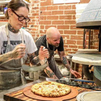 The staff preparing food.