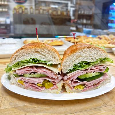 A large turkey sandwich cut in half.