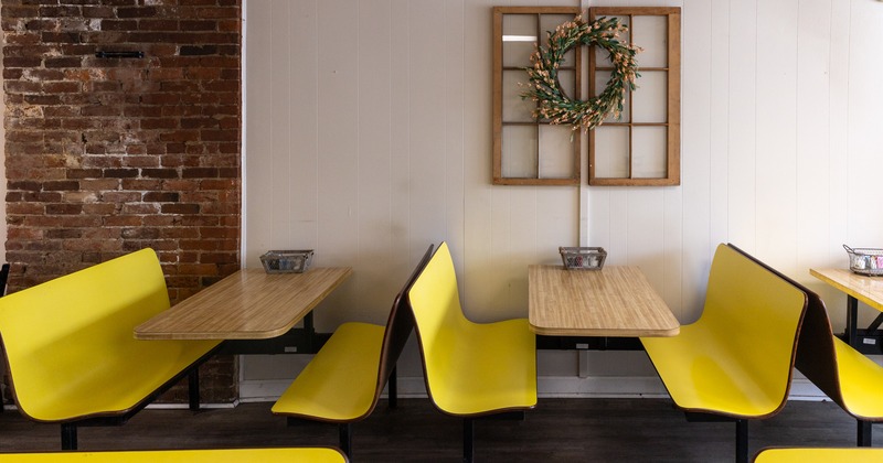 Interior, seating area with tables ready for guests