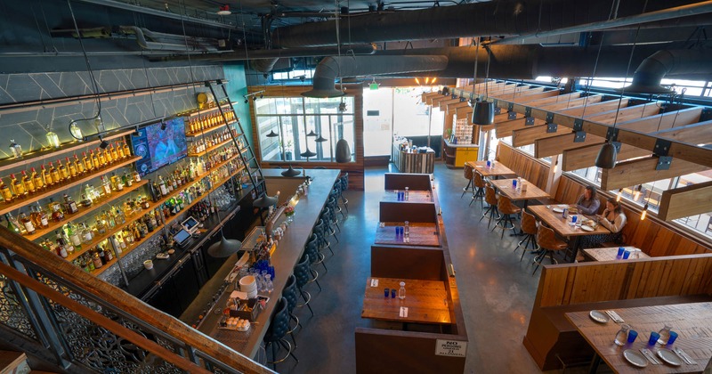 Interior, restaurant view from upstairs private room, seating area and bar