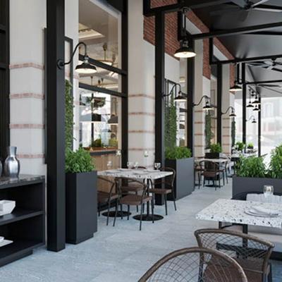 Covered patio seating area with hanging lights, set tables and chairs.