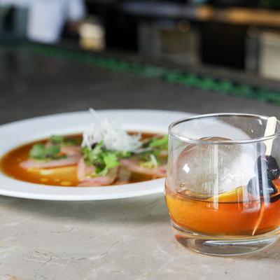 Smoked Old Fashioned with Yellowtail Jalapeno appetizer.