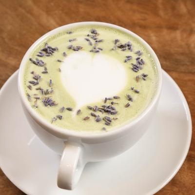 A cup of lavender matcha latte.