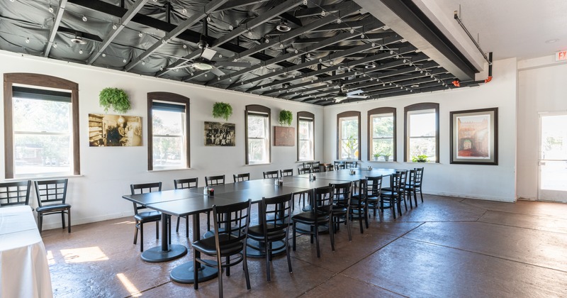 Interior, conjoined tables with chairs