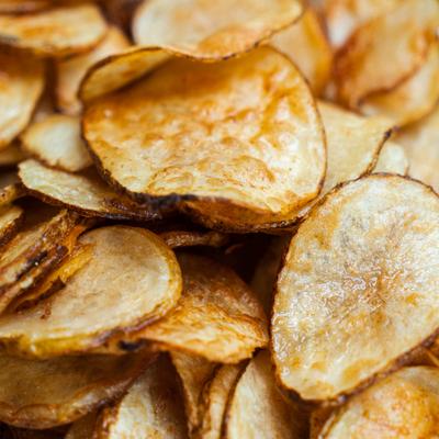 Potato chips with natural skin edges, close-up.