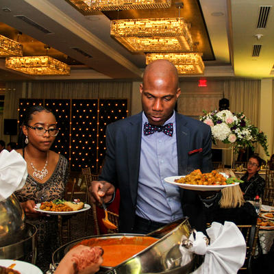 A couple pouring sauce