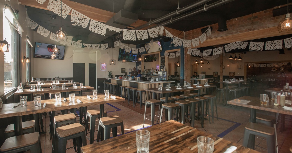 Interior, dining area with high tables and chairs