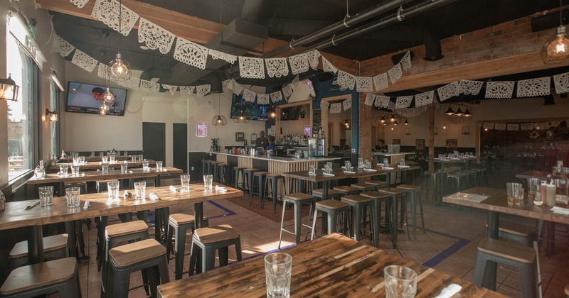 Interior, dining area with high tables and chairs