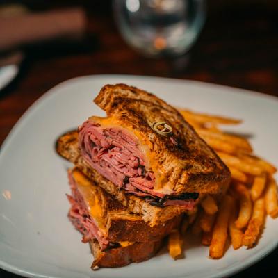 The Reuben on Rye Bread, with Swiss Cheese, Pastrami, Sauerkraut, 1000 Island Dressing.