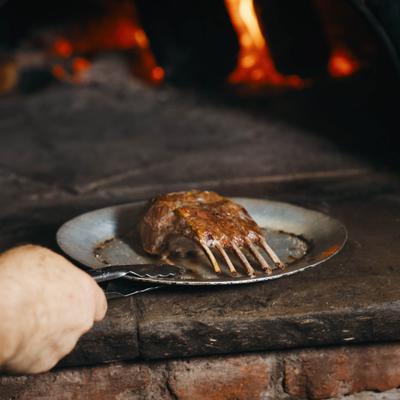 Rack of lamb in a wood burning oven.
