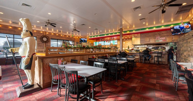 Interior, dining area, tables for six, long cornered room divider, carpet flooring