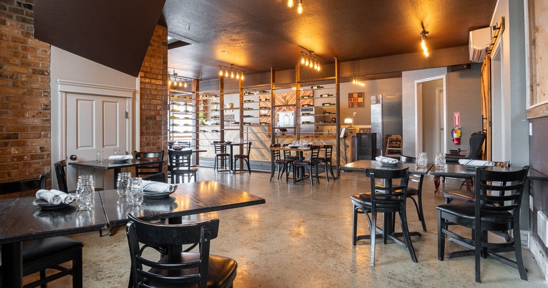 Interior, dining area with tables set for guests