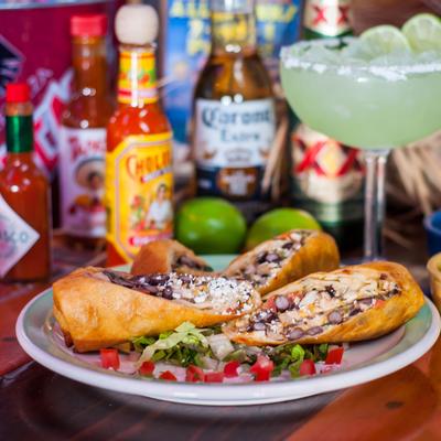 Santa Monica Rolls with a margarita and hot sauces