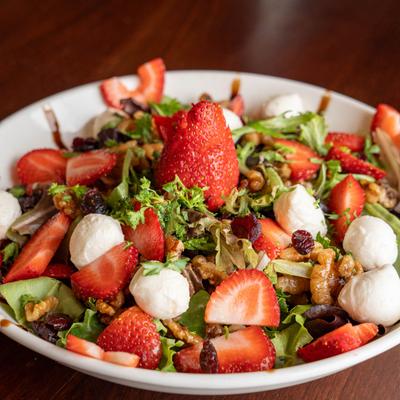 A closeup on a strawberry salad.