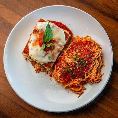 Eggplant Parmesan, served with spaghetti marinara.