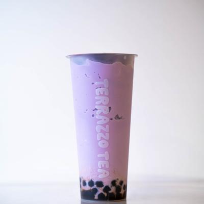 A tall, pale purple bubble tea cup labeled Terrazzo Tea set against a white background.