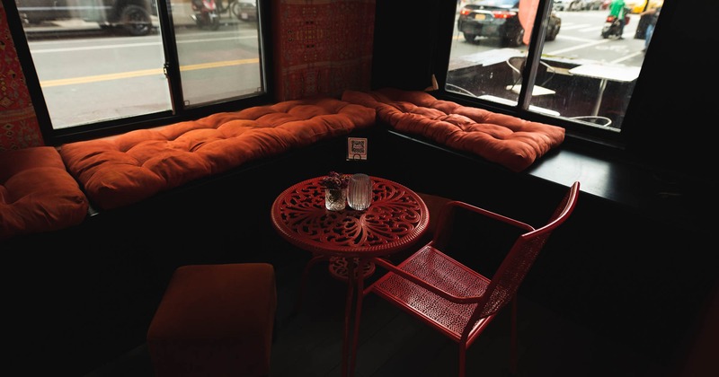 Interior, round ornamented table and chairs