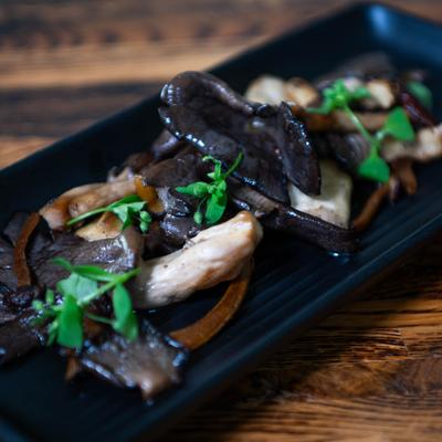 Sauteed mushrooms garnished with microgreens.
