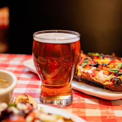 A glass of beer and food.