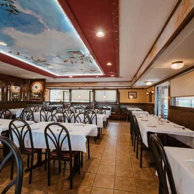 Dining room with a partially painted ceiling.