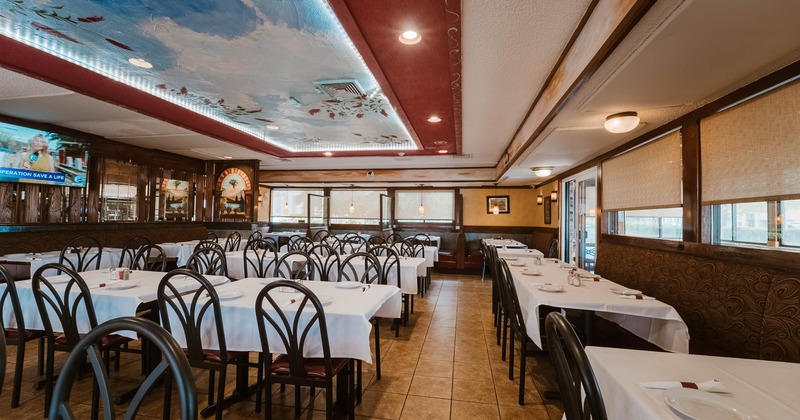 Interior, dining tables ready for guests