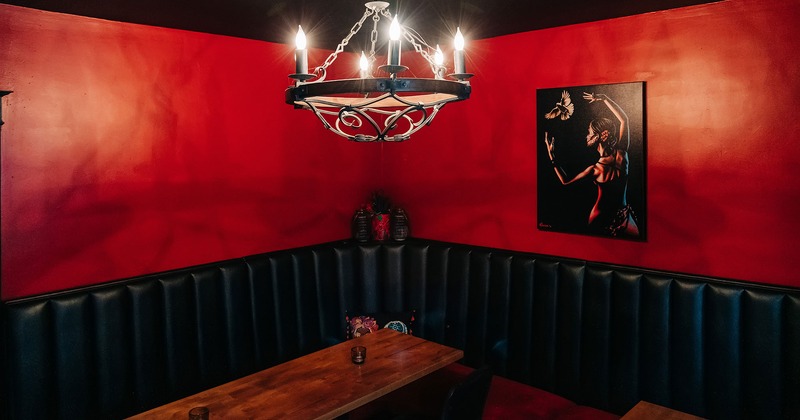 Interior, restaurant booth and chandelier above it