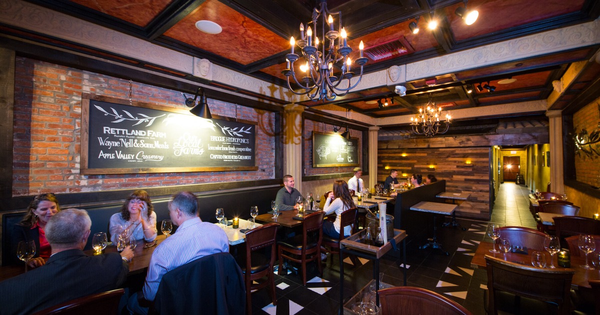 Customers sitting and drinking wine