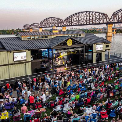 Crowds enjoying a concert at the river stage